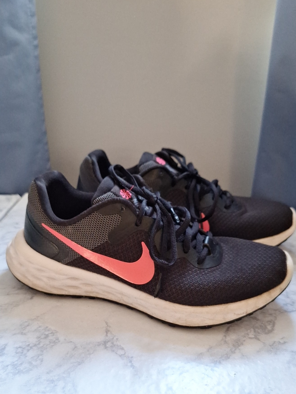 Nike WoMen’s Athletic Shoes in Black with Coral Swoosh, Revolution